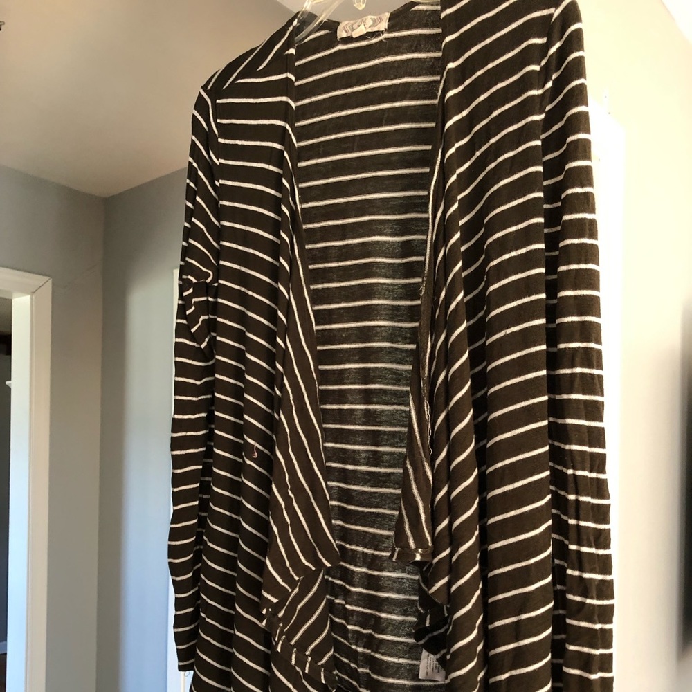 Super soft long sleeve cardigan. Long in the front
